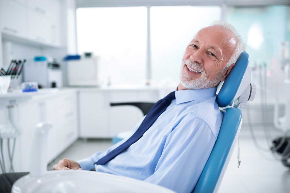 patient smiling after his dental treatment with sedation