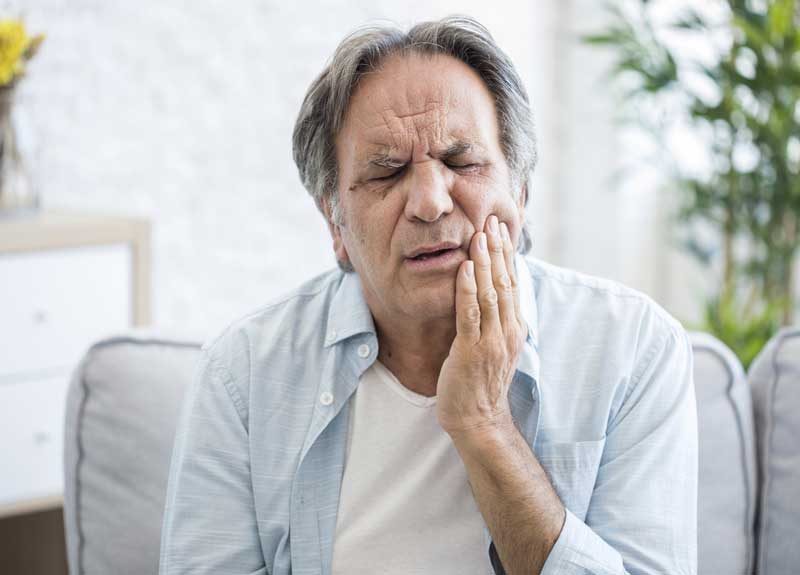 elderly man with jaw pain