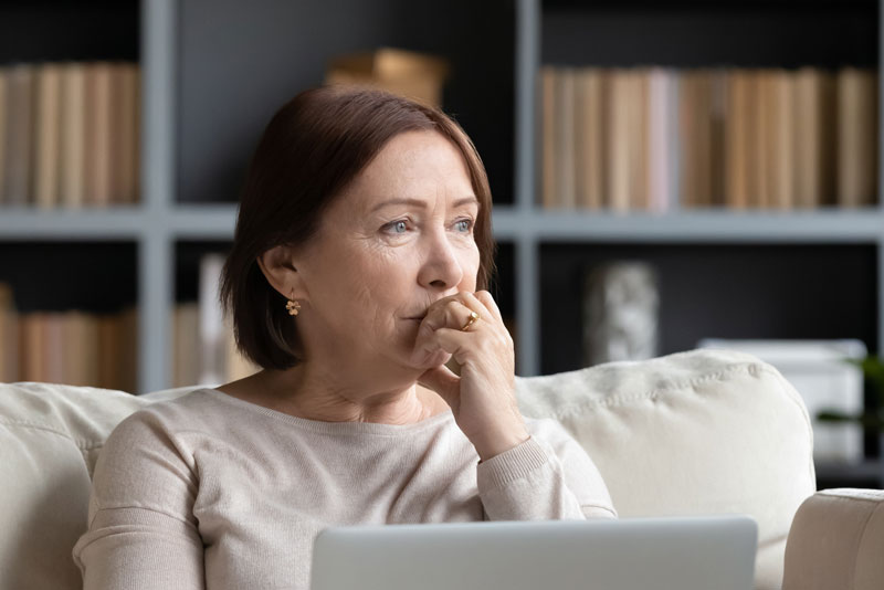 Dental Patient Wondering If She Should Get Dental Implants Or Dentures in Danbury, CT