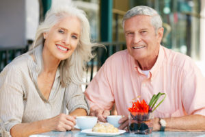 Dental Implant Patients Eating Together With Their False Teeth in Danbury, CT